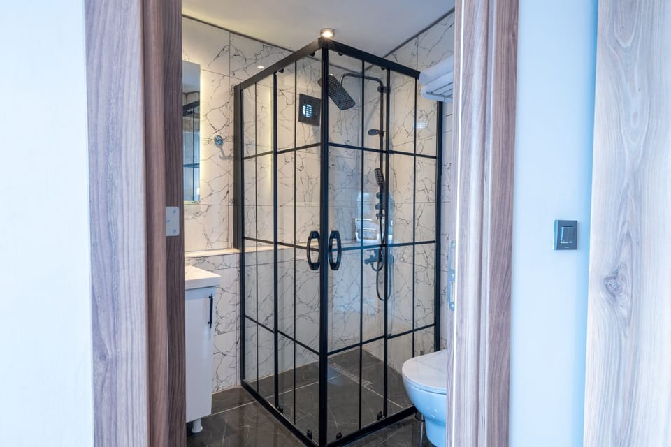 Shower, hair dryer, slippers, towels