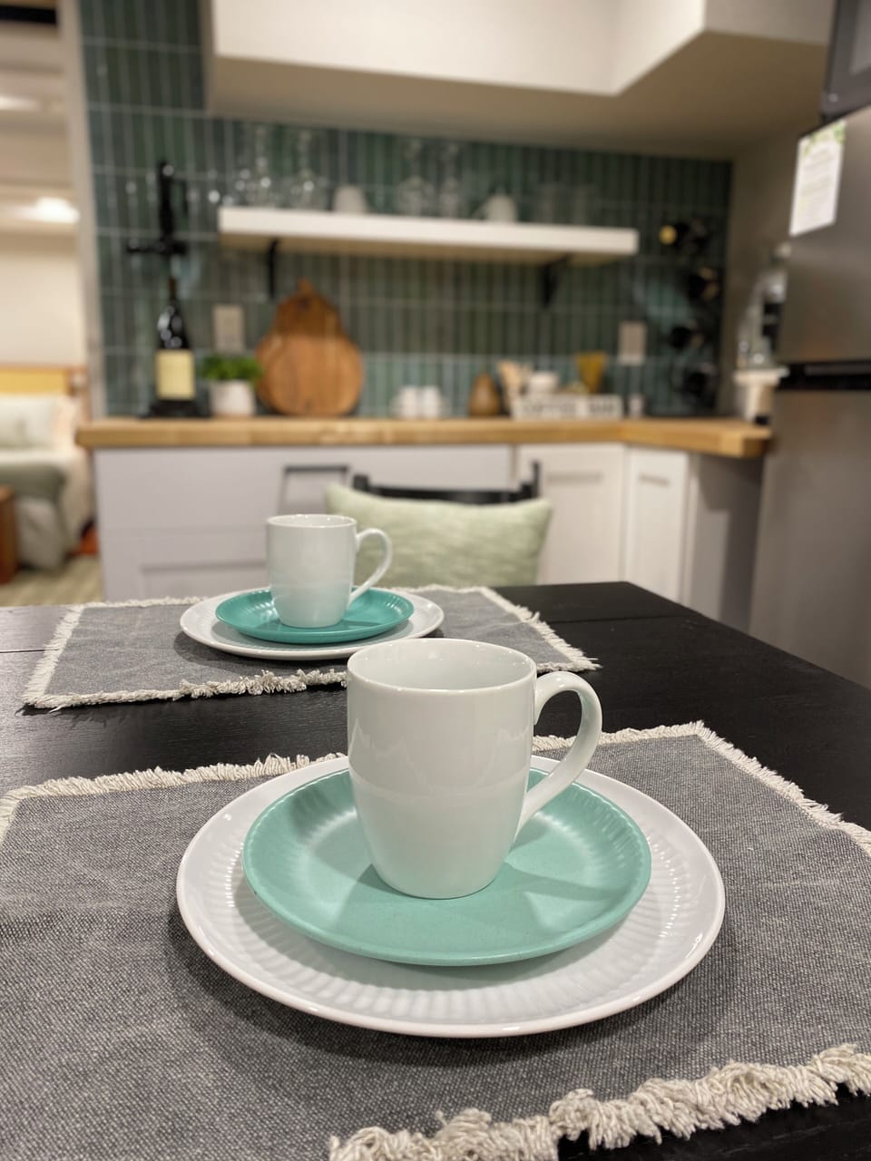 Expanding dining table. Stocked Kitchenette. Sink located in laundry room.