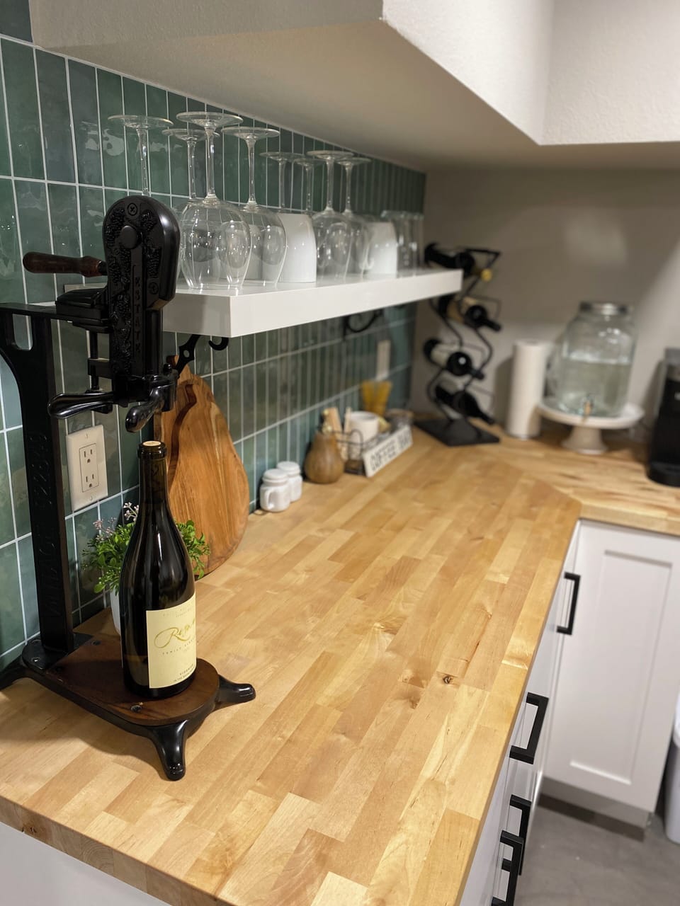 Dishes, Keurig, Kettle, Toaster, Microwave, Refrigerator, utensils. No sink.