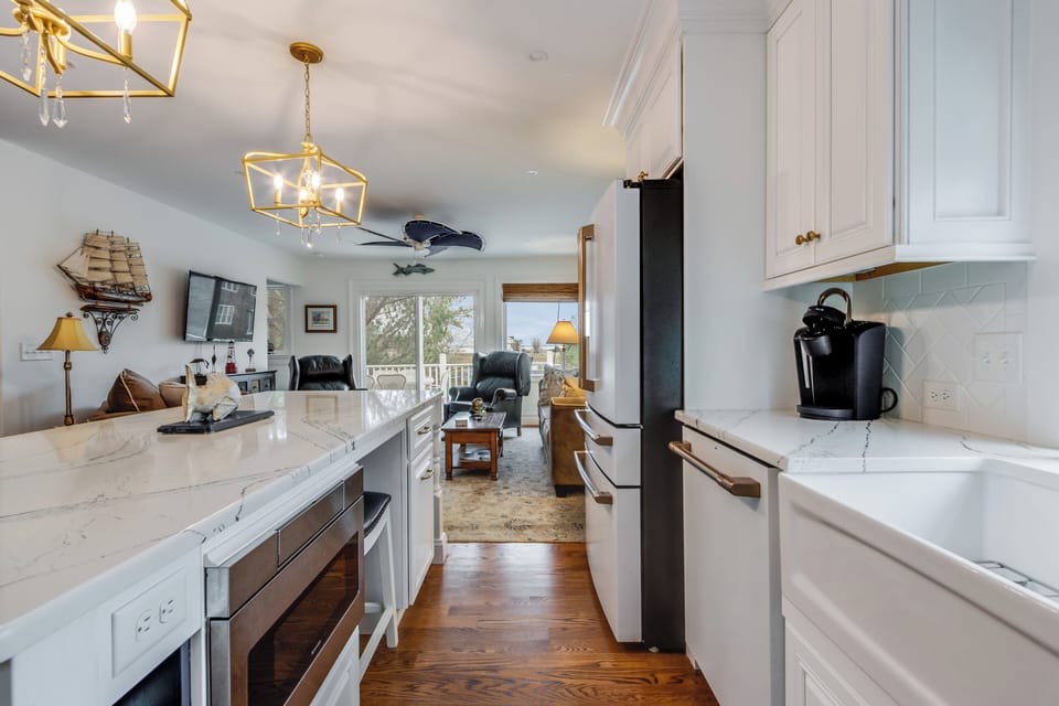 View of open kitchen/LR area with Keurig coffee maker