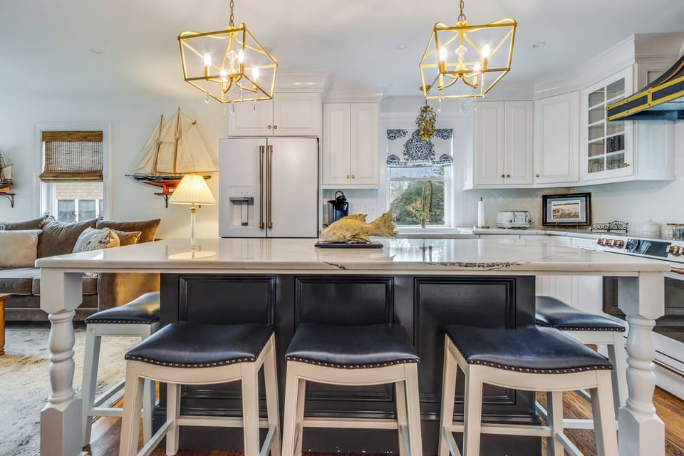 The charming gold lighting in the kitchen adds character to the space