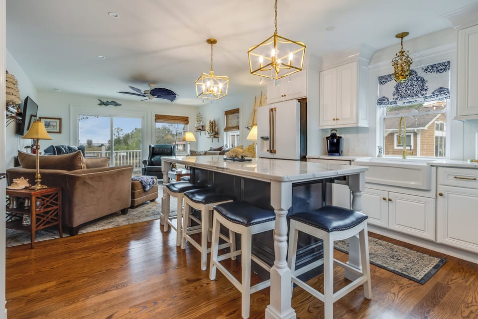 Plenty of bar seating at the large quartz counter top island 
