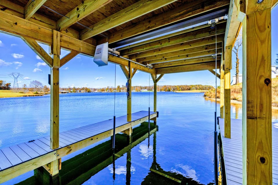 Dock - Covered dock with boat slips and casual seating.