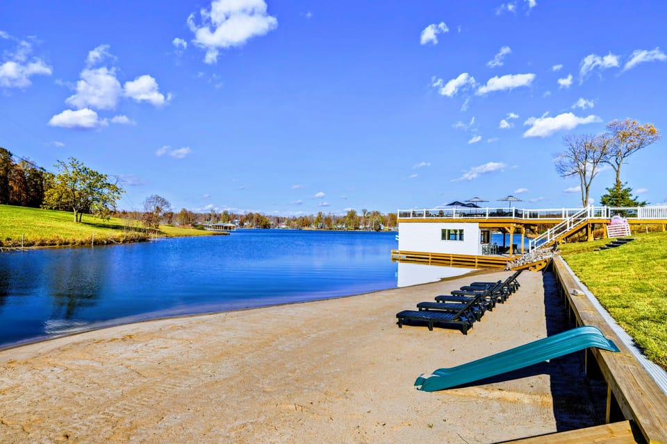 Beach - Lounge chairs, a slide, and dock access from the sandy beach.