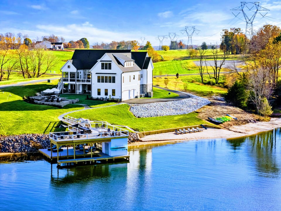 Dock - Two-level dock with covered seating, lounge chairs, and direct water access.