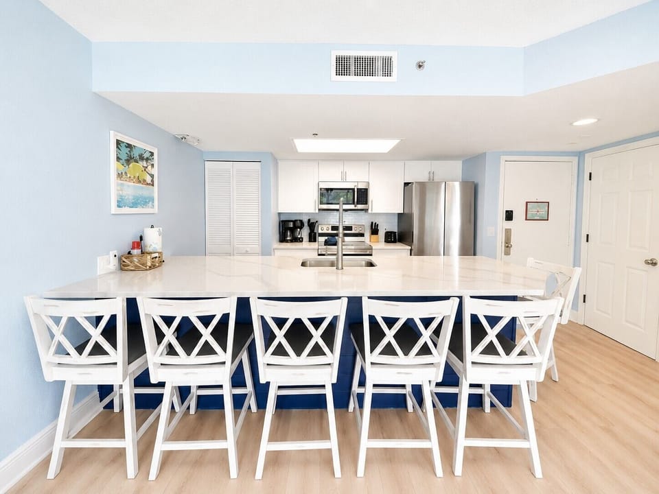 Gather around the oversized kitchen island with plenty of seating for meals, morning coffee, or planning your next Key West adventure.