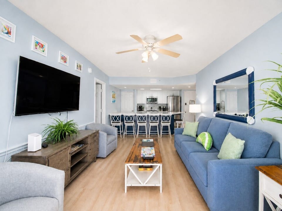 Kick back and relax in the bright, open living room with plenty of comfortable seating, a large TV, and the kitchen just steps away. It’s the perfect place to spend time together after a day in Key West.