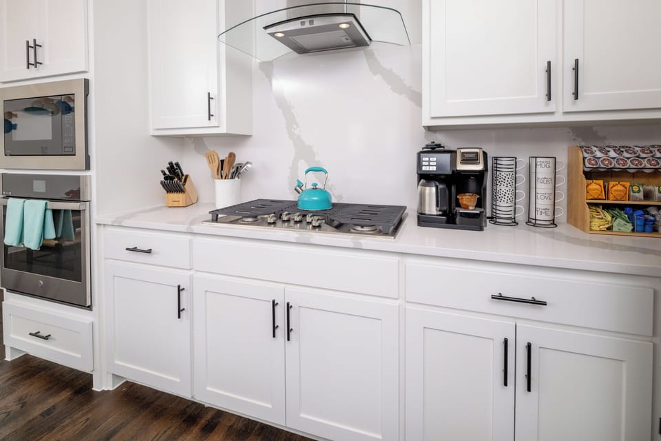 Fully stocked kitchen, with coffee, tea kettle, and creamers available for use.