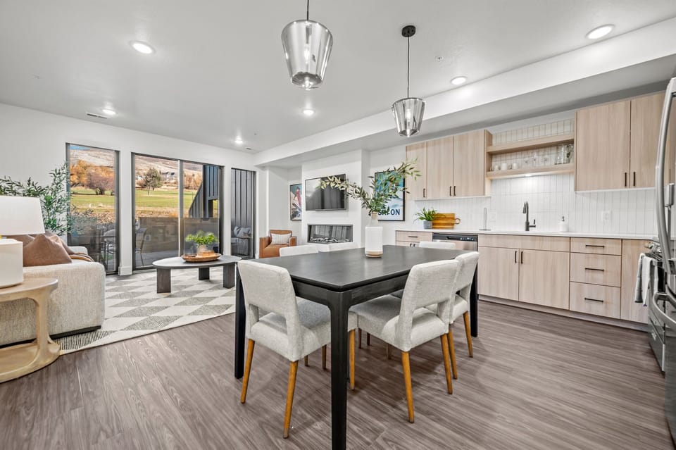 The open-concept living space, complete with a dining area, facilitates effortless conversation with family and friends.