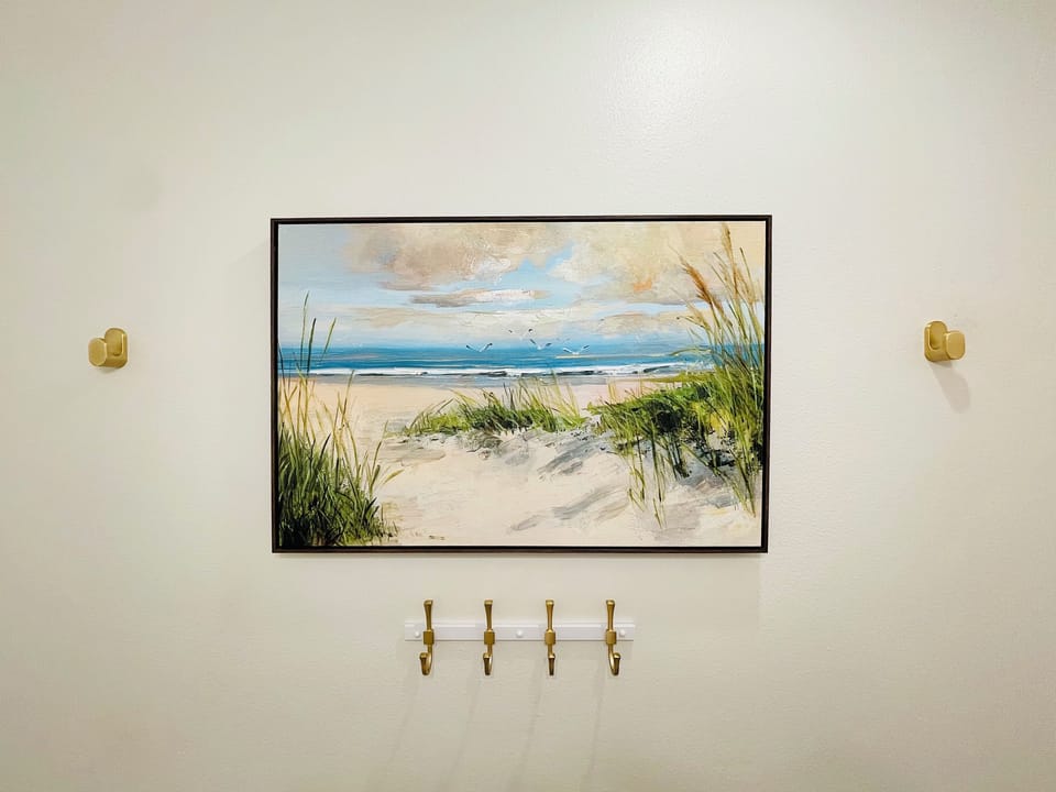 Half bath perfect for hanging wet towels & swimsuits after a day at the beach
