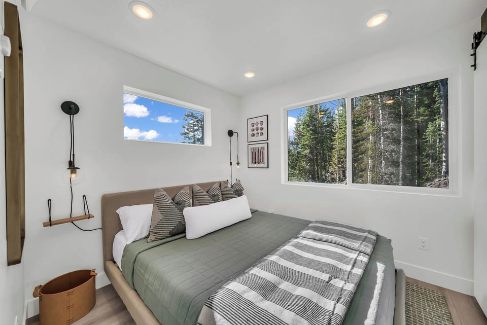 A queen bedroom downstairs, with a door of its own.