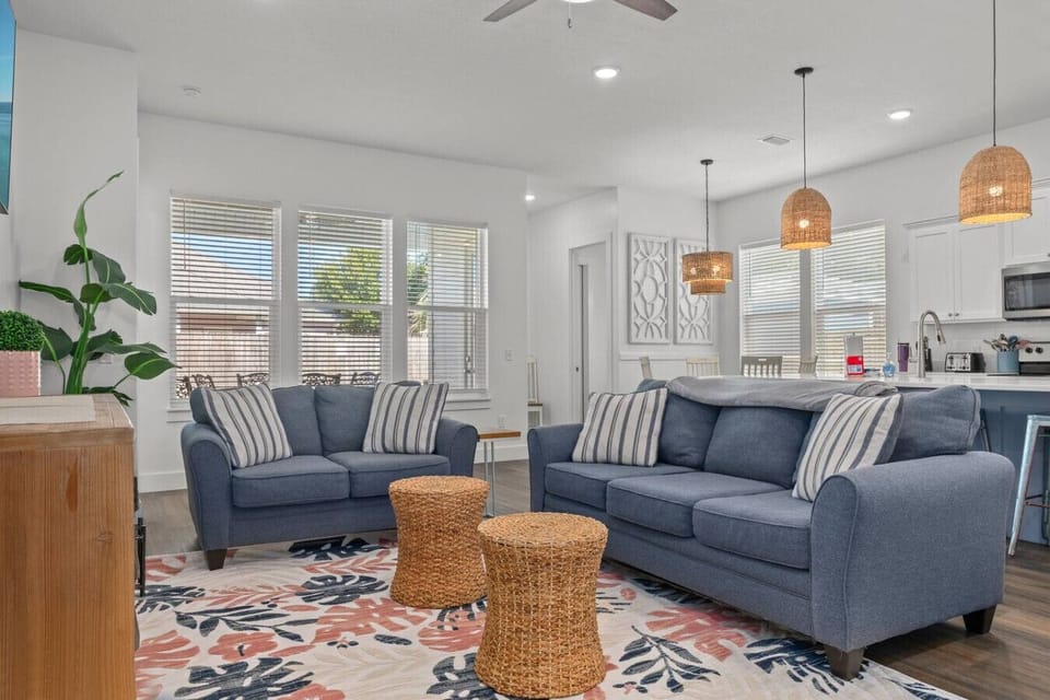 A cozy living room with two inviting couches, creating a comfortable and stylish space perfect for relaxation and gatherings.