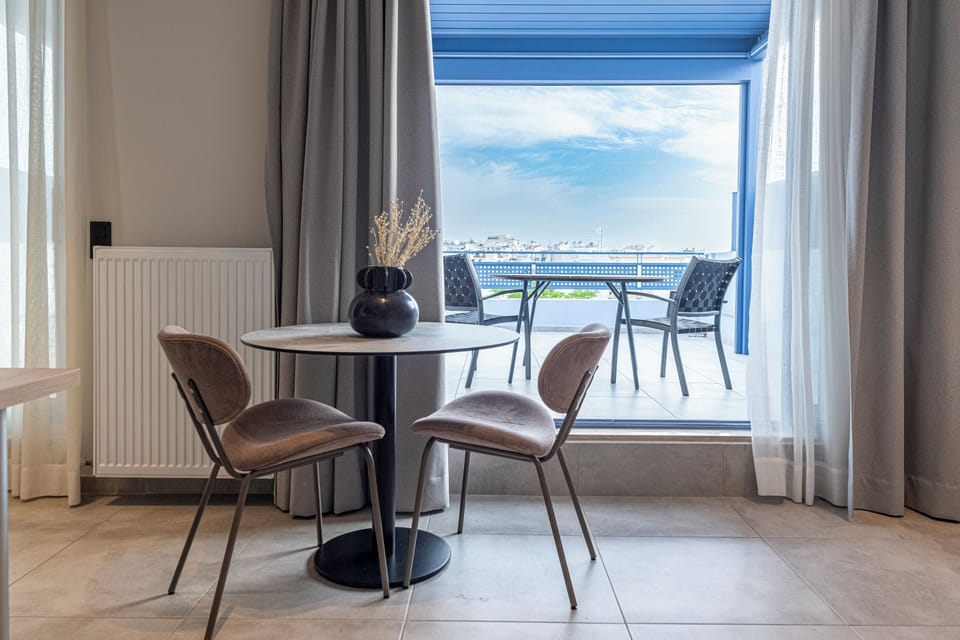 Luxury Studio, City View | Living area | Flat-screen TV