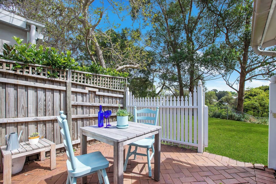 Backyard Courtyard - this leads onto a spacious grassy area that guests are also welcome to use