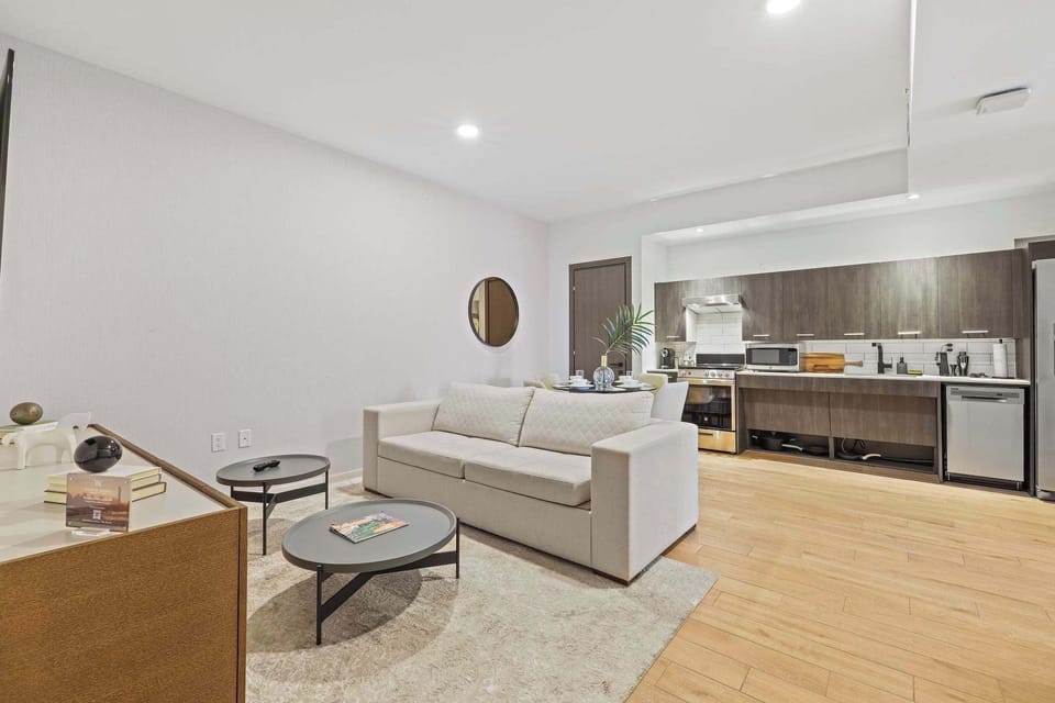 Cozy studio with a modern kitchen and comfortable living space, perfect for a relaxing stay.