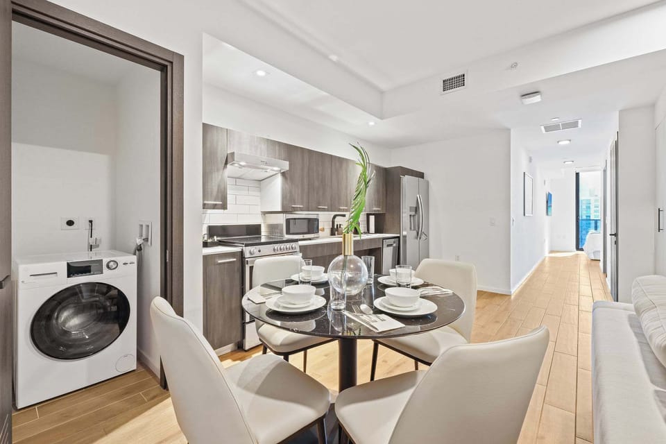 Enjoy a sleek, modern kitchen with all the essentials for a comfortable stay in this stylish studio apartment.