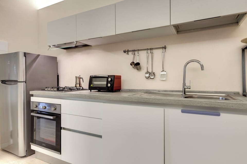 Apartment, 1 Bedroom | Private kitchen | Full-size fridge, microwave, stovetop, dishwasher