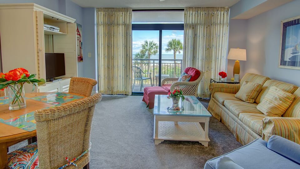 Living room with private balcony access