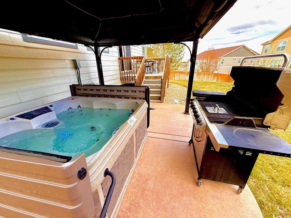 Relax in the hot tub, enjoy a meal on the grill, and unwind on the patio, all set against a beautiful backdrop