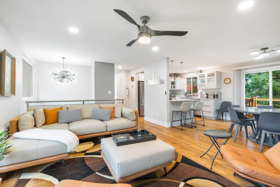 The cozy living room blends style and comfort. Settle in with a movie or gather the group for a glass of wine.

