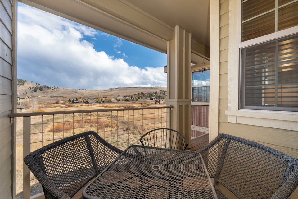 Sip your morning coffee on this covered balcony while taking in sweeping mountain vistas that stretch endlessly before you.