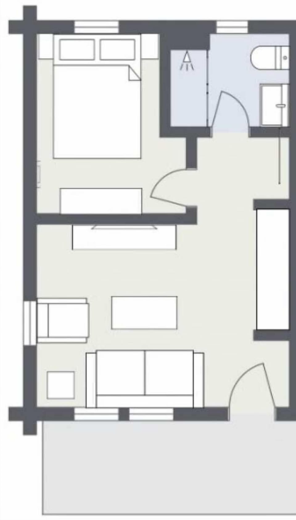 Room Layout: This thoughtfully designed space features a separate bedroom, living area, and private bathroom, offering comfort and functionality for a relaxing stay.