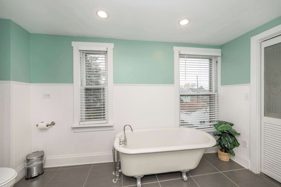 Wash up in the full bath, boasting a glass shower & claw-foot soaking tub