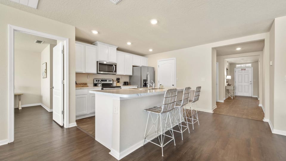 Sip morning coffee or grab a bite at the kitchen counter, with seating for 3