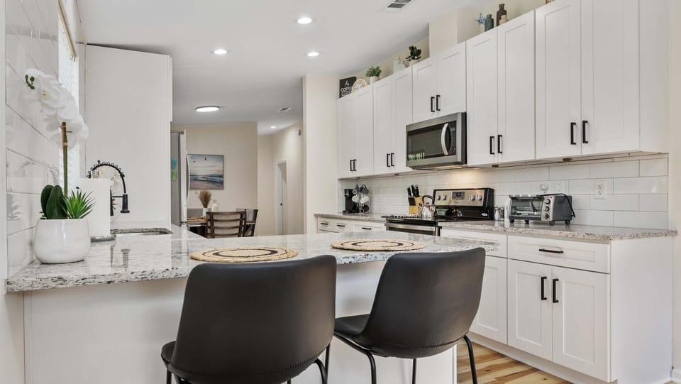 Sip morning coffee or grab a bite at the kitchen counter, with seating for 2
