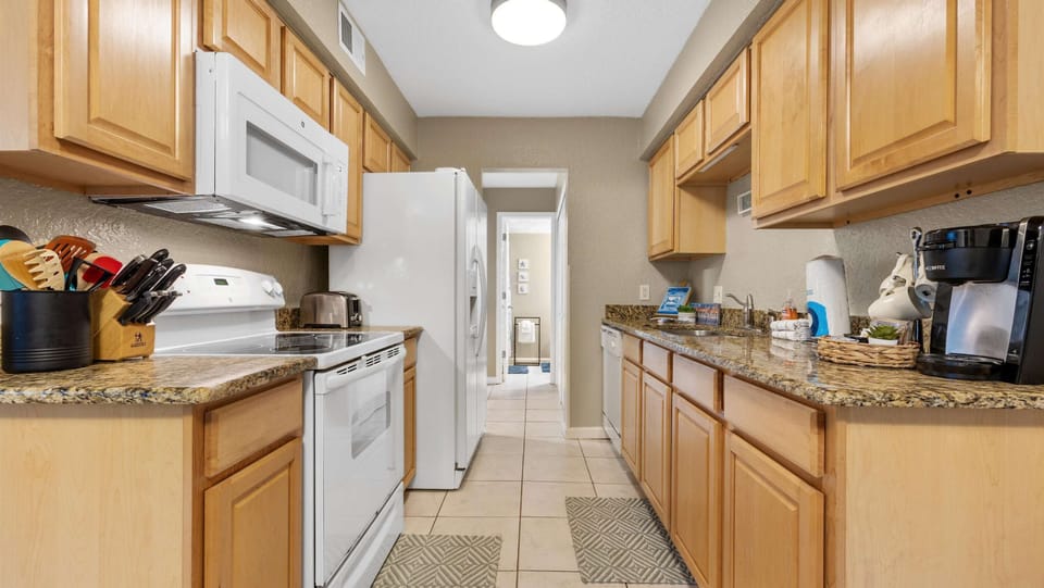 The kitchen offers ample space & all the comforts of home