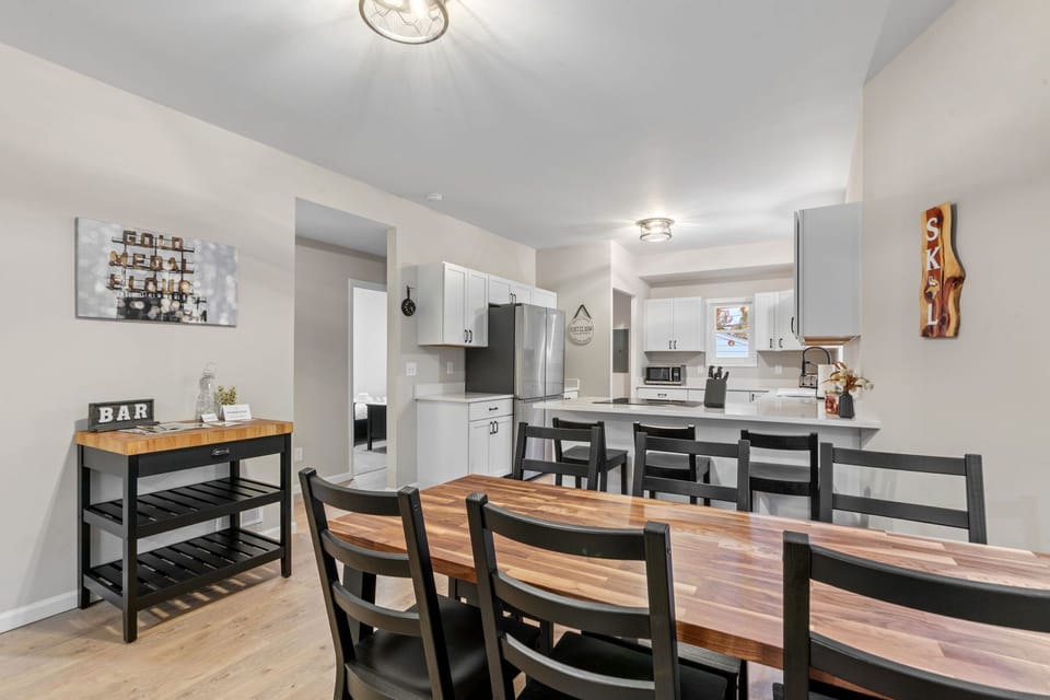 Your spacious open kitchen and dining area features modern appliances and a welcoming table for eight—perfect for memorable meals together.