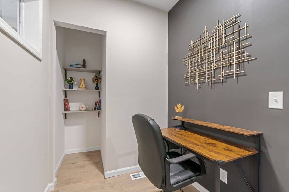 Stay productive in your dedicated workspace featuring a stylish desk, comfortable chair, and built-in storage nook for all your essentials.