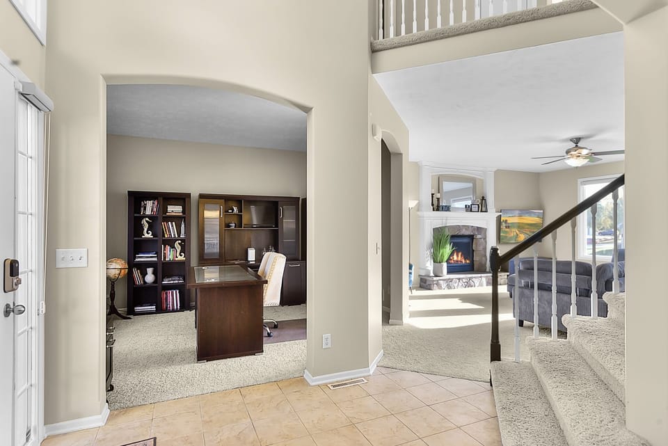 Step into your home away from home, where an inviting office nook and cozy living spaces create the perfect blend of work and relaxation.