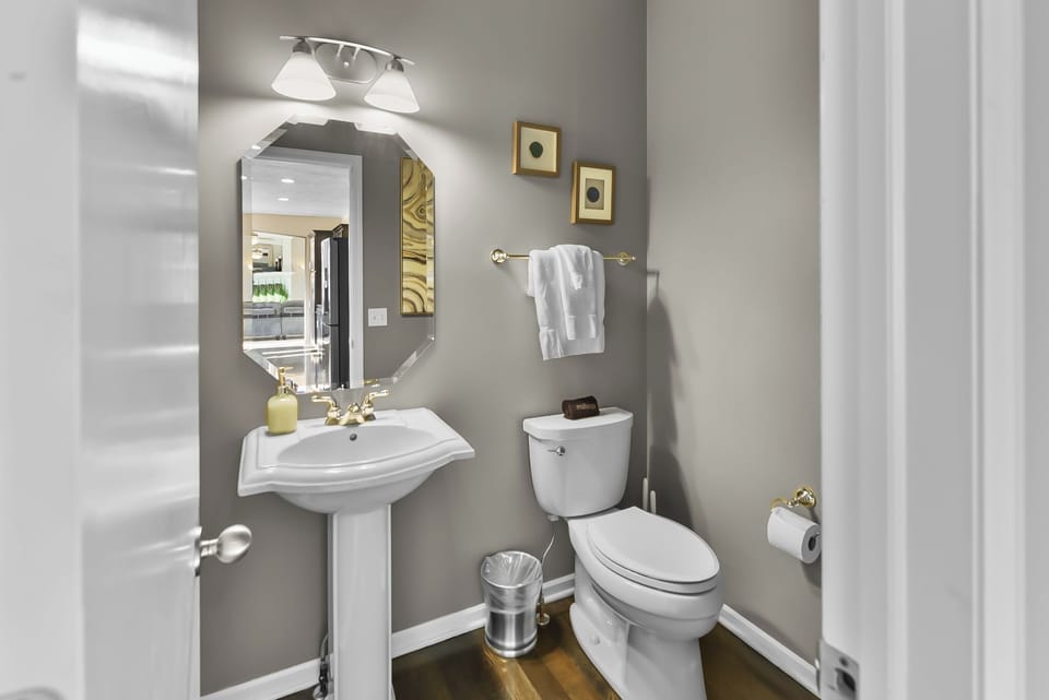Freshen up in your private powder room, complete with modern fixtures and thoughtful touches for your comfort.