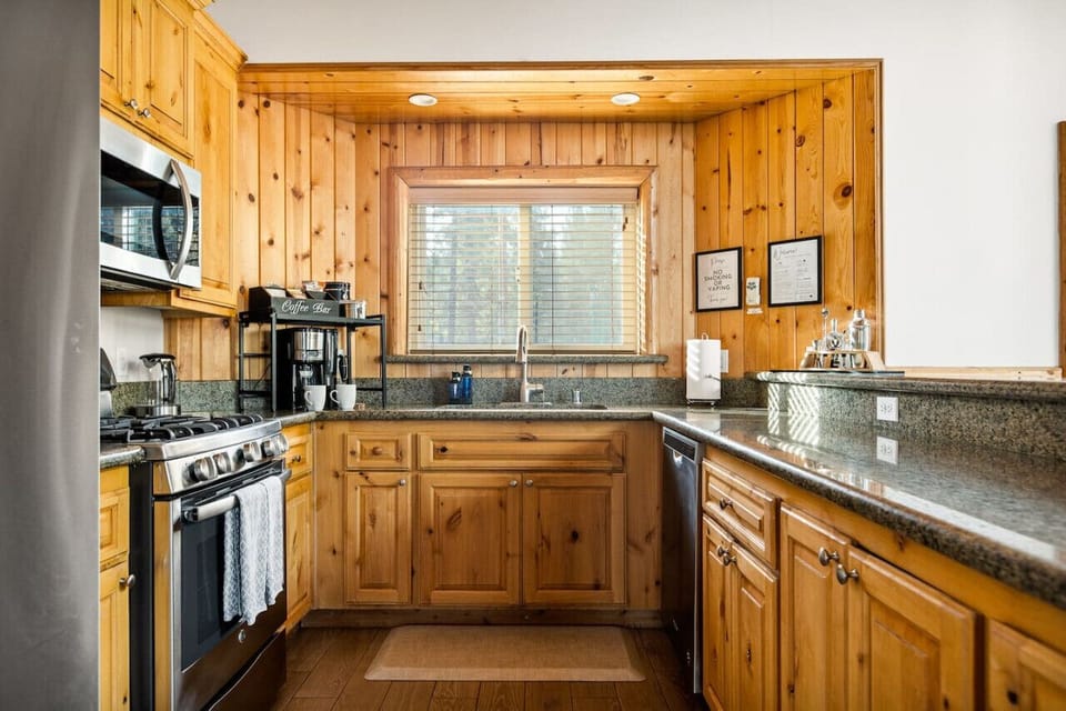 Fully equipped kitchen featuring a drip coffee maker.