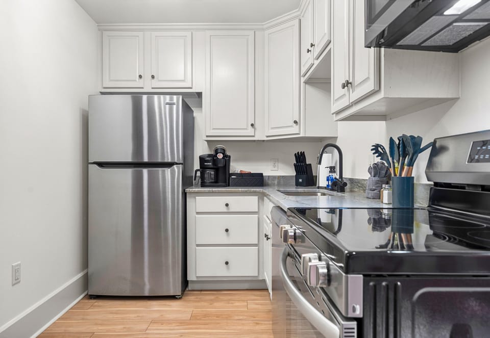 A fully equipped kitchen with stainless steel appliances and just the right amount of counter space makes meal prep a breeze, whether you're cooking a feast or a quick snack.