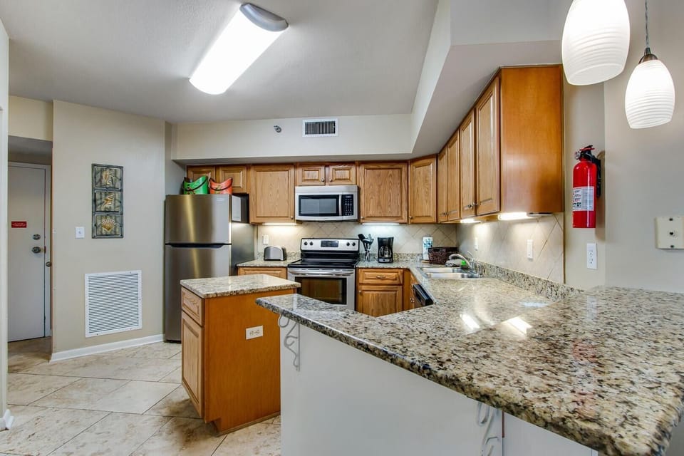 Condo, Multiple Beds (Pelican Pointe 1406) | Private kitchen | Oven, dishwasher, toaster