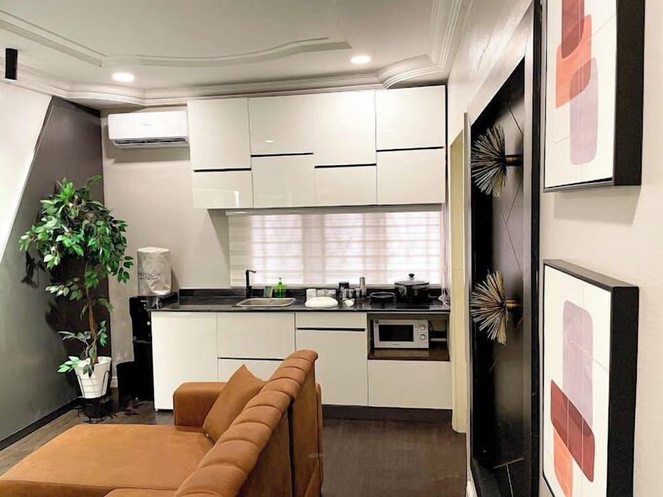 Family Apartment, Balcony, City View | Living area | Flat-screen TV