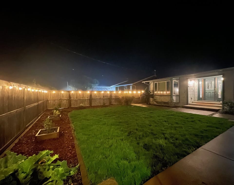 Courtyard at night, fully fenced and secure.