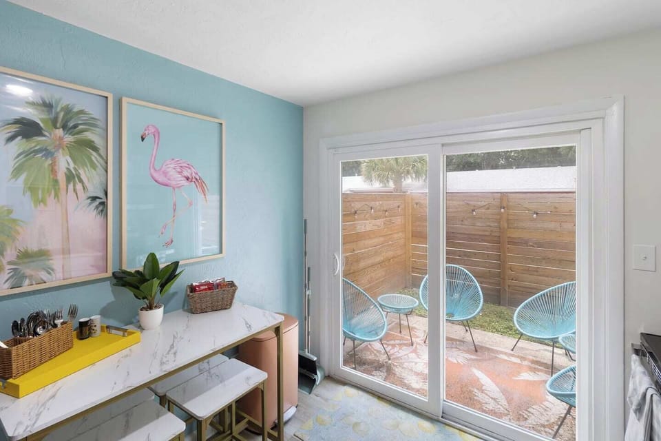 Dining Nook: Bright and airy space with trendy decor and a charming patio view for meals al fresco!