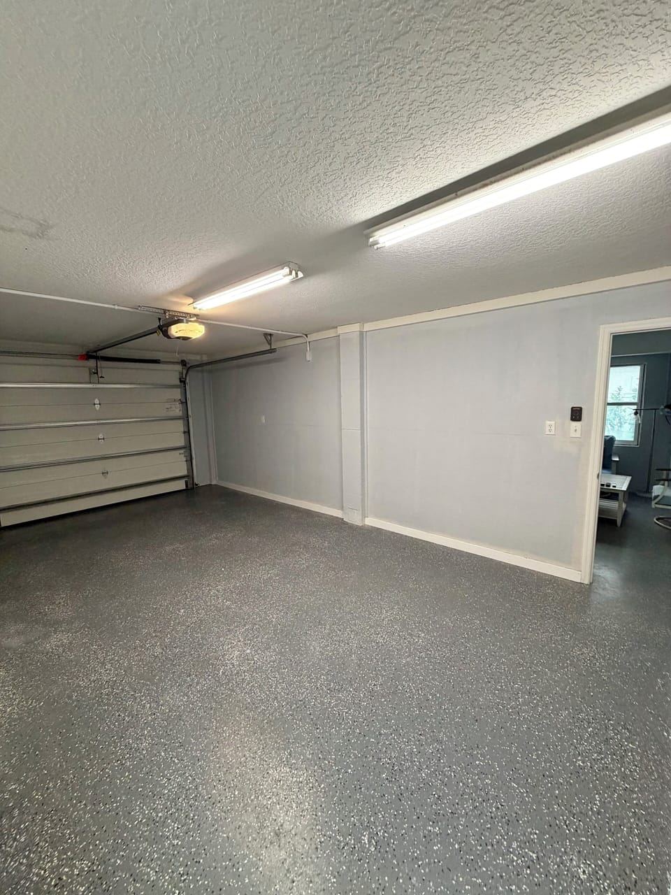 Two garage stalls! Bright & auto doors Plus covered parking for another 4 cars! 