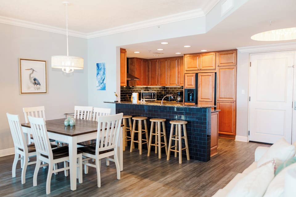 The condo has a dining room with plenty of seating.