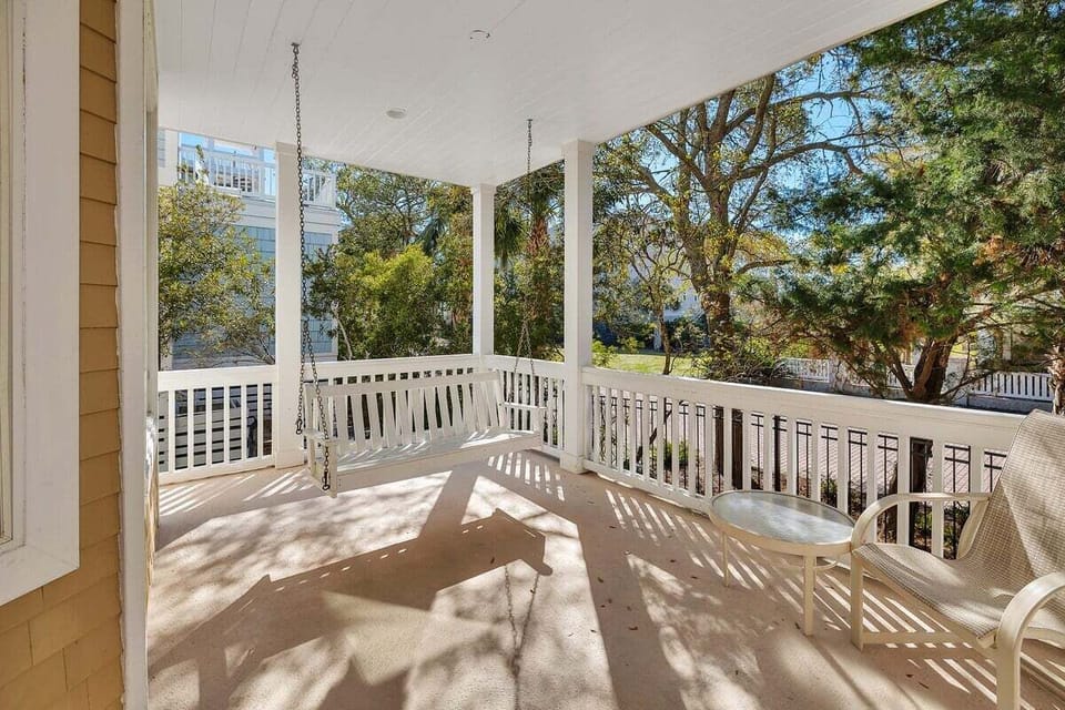 Covered porch with swing and neighborhood views