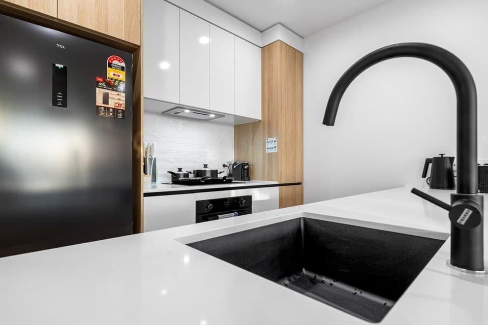 Featuring brand-new appliances, including a fridge, microwave, and dishwasher, ready for your use
