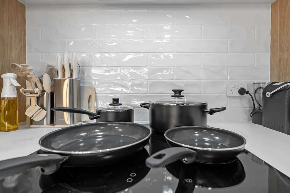 Cook with ease in a kitchen stocked with all essential cookware and kitchenware.
