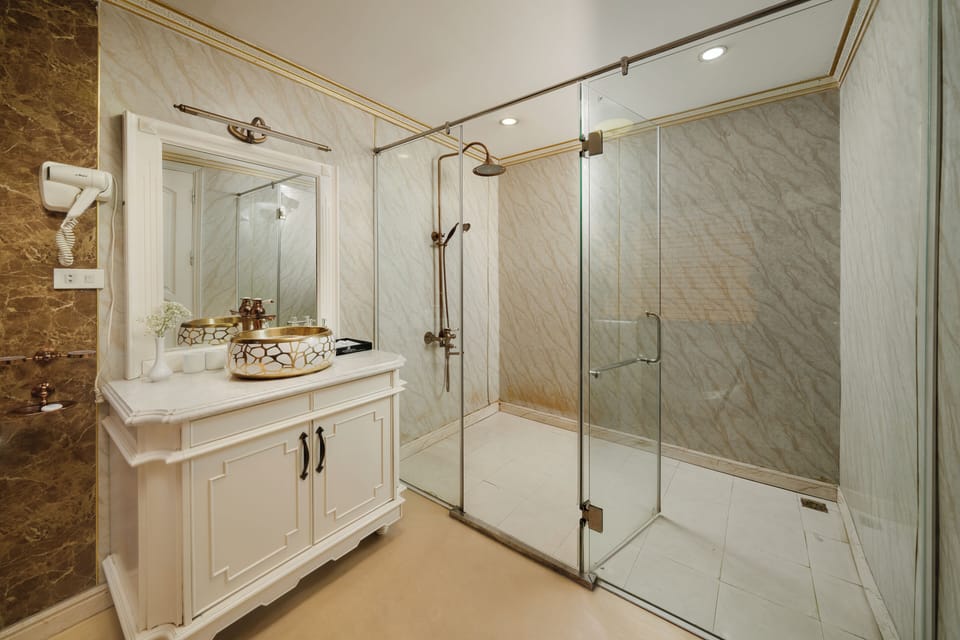 Shower, hair dryer, slippers, towels