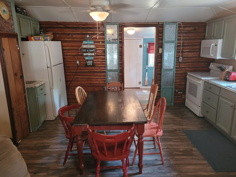 DINING AREA:  There is a cute dining table with seating for 6 adults in the middle of the kitchen.