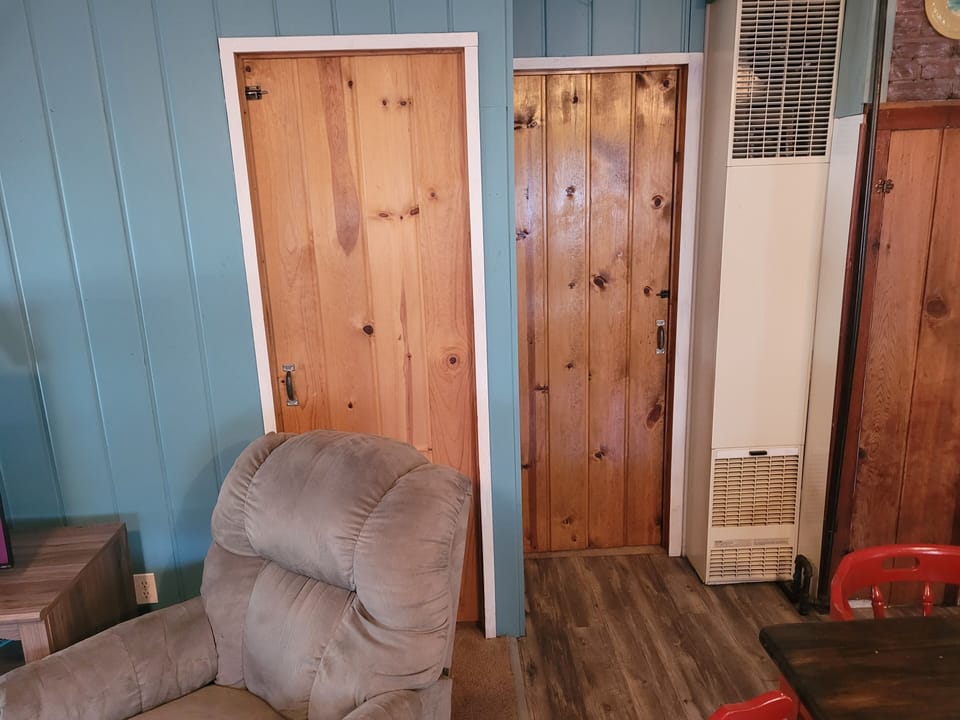BEDROOMS:  These 2 doors are the entrances to the 2 bedrooms.