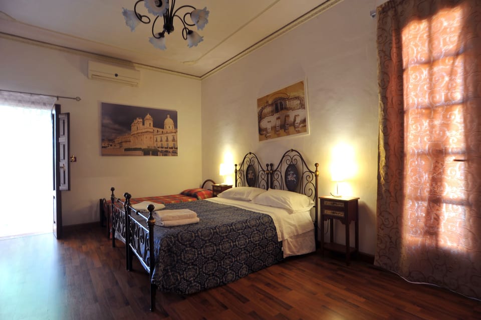 Apartment, 1 Bedroom | 3 bedrooms, down comforters, in-room safe, iron/ironing board