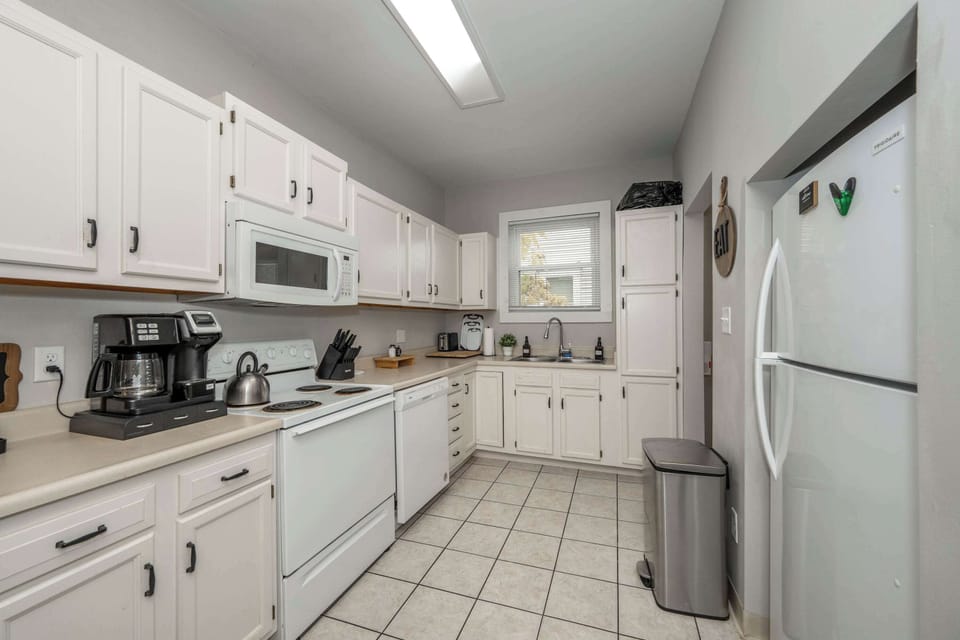 The breezy kitchen offers ample space & every home comfort